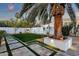 Lush backyard with a manicured lawn, beautiful landscaping, and an elegant patio at 8713 N 80Th Pl, Scottsdale, AZ 85258