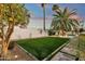 Expansive backyard featuring lush green grass and mature landscaping, creating a private oasis at 8713 N 80Th Pl, Scottsdale, AZ 85258