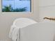 Close up of bathroom soaking tub with gold fixtures and textured white wall at 8713 N 80Th Pl, Scottsdale, AZ 85258