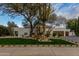 Inviting home featuring a water feature, desert foliage, and lush green lawn at 8713 N 80Th Pl, Scottsdale, AZ 85258