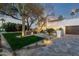 Gorgeous home showcasing manicured front lawn with elegant desert landscaping features at 8713 N 80Th Pl, Scottsdale, AZ 85258