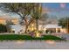 Charming front exterior with beautiful greenery and a serene water feature at 8713 N 80Th Pl, Scottsdale, AZ 85258