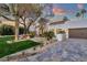 Charming front yard with desert landscaping and a white stucco home exterior at 8713 N 80Th Pl, Scottsdale, AZ 85258