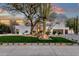 Charming front yard with desert landscaping and a white stucco home exterior at 8713 N 80Th Pl, Scottsdale, AZ 85258