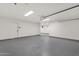 Spacious garage with epoxy flooring and ample room for storage and parking at 8713 N 80Th Pl, Scottsdale, AZ 85258