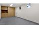 Well-organized garage featuring built-in cabinets and durable epoxy flooring at 8713 N 80Th Pl, Scottsdale, AZ 85258