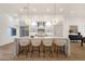 Bright modern kitchen featuring a marble island with seating and stainless steel appliances at 8713 N 80Th Pl, Scottsdale, AZ 85258