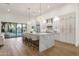 Bright, open kitchen with a large marble island, stainless steel appliances, and backyard view at 8713 N 80Th Pl, Scottsdale, AZ 85258