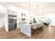 A spacious kitchen with a marble island, stainless steel appliances and white cabinets, great for entertaining at 8713 N 80Th Pl, Scottsdale, AZ 85258