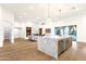 Open concept living room and kitchen with fireplace and modern finishes, great for entertaining at 8713 N 80Th Pl, Scottsdale, AZ 85258