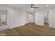 Spacious main bedroom with hardwood flooring, ensuite bathroom access, and a walk-in closet, offering comfort and convenience at 8713 N 80Th Pl, Scottsdale, AZ 85258