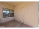 View of covered patio with exterior door and bright windows, offering relaxation and outdoor access at 9325 W Hazelwood St, Phoenix, AZ 85037