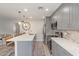 Contemporary kitchen design with breakfast bar, stainless appliances, and stylish backsplash at 1050 N 84Th Pl, Scottsdale, AZ 85257