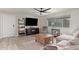 Bright living room featuring wood floors, modern furnishings, and a ceiling fan at 1050 N 84Th Pl, Scottsdale, AZ 85257