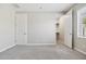 Neutral carpeted bedroom with closet and a view to the outside at 10630 W Pinchot Ave, Avondale, AZ 85392