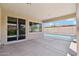 A covered patio area with a view of the backyard pool at 10630 W Pinchot Ave, Avondale, AZ 85392