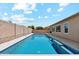 Backyard oasis with clear pool water for exercise and relaxation surrounded by privacy wall and ample deck space at 10630 W Pinchot Ave, Avondale, AZ 85392