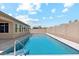 Backyard pool featuring a cool blue tile and clear water surrounded by well maintained block fencing and yard at 10630 W Pinchot Ave, Avondale, AZ 85392