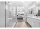 This modern bathroom boasts an expansive walk-in shower with glass surround and dual vanity sinks at 10633 E Sheffield Dr, Mesa, AZ 85212