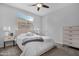 Inviting bedroom with bright natural light, neutral tones, and light wood furniture at 10633 E Sheffield Dr, Mesa, AZ 85212