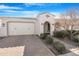 Inviting one-story home with a two-car garage, desert landscaping, and a charming entryway at 10633 E Sheffield Dr, Mesa, AZ 85212