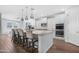 Spacious kitchen featuring a large island with seating and sleek white cabinetry at 10633 E Sheffield Dr, Mesa, AZ 85212