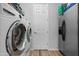 Functional laundry room featuring a modern washer and dryer set and a stainless steel refrigerator at 10633 E Sheffield Dr, Mesa, AZ 85212