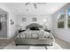 Tranquil main bedroom with plush carpeting, neutral walls, and ample natural light from surrounding windows at 10633 E Sheffield Dr, Mesa, AZ 85212