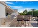 Outdoor kitchen featuring a built-in grill and seating perfect for backyard barbecues and entertainment at 10633 E Sheffield Dr, Mesa, AZ 85212