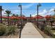 Charming outdoor seating area with picnic tables, string lights, and shade umbrellas perfect for gathering with friends and Gathering at 10633 E Sheffield Dr, Mesa, AZ 85212