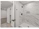 Beautiful bathroom featuring a new walk-in shower with marbled tile and matte black hardware at 10956 W Meade Dr, Sun City, AZ 85351