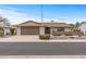 Inviting single-story home with a well-maintained front yard, desert landscaping and an attached garage at 10956 W Meade Dr, Sun City, AZ 85351