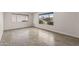 Bright room with tile flooring, large windows and neutral paint at 10956 W Meade Dr, Sun City, AZ 85351