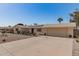 Single-story home with an attached two-car garage and desert landscaping at 11468 N Desert Hills Dr, Sun City, AZ 85351