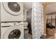 Well-equipped laundry room with washer and dryer and built in storage at 11468 N Desert Hills Dr, Sun City, AZ 85351