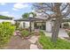 Serene backyard setting with a shaded patio area, beautiful landscaping, and mature trees at 1216 E Rancho Dr, Phoenix, AZ 85014