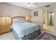 Serene bedroom with plush carpeting, ceiling fan, and an ensuite bathroom at 1216 E Rancho Dr, Phoenix, AZ 85014