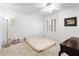 Bright bedroom with a large window offering ample natural light and a neutral color scheme at 1216 E Rancho Dr, Phoenix, AZ 85014