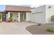 Charming front exterior view of a home with a red tile roof, white stucco walls, and a well-manicured yard at 1216 E Rancho Dr, Phoenix, AZ 85014