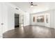 Spacious bedroom with wood floors, a ceiling fan, and a large window at 1227 W 12Th Ave, Apache Junction, AZ 85120