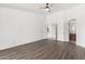 Bright bedroom with wood flooring leading to the bathroom and closet at 1227 W 12Th Ave, Apache Junction, AZ 85120