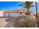 Charming single-story home featuring a three car garage and mature desert landscaping at 1227 W 12Th Ave, Apache Junction, AZ 85120