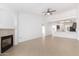 Living room featuring tile floors, fireplace, and access to the open kitchen at 1227 W 12Th Ave, Apache Junction, AZ 85120