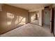 Bedroom featuring a mirrored closet awaiting flooring and paint to realize its full potential at 1384 N Santa Anna Ct, Chandler, AZ 85224