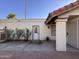 Exterior view showing stucco siding, tile roof and door leading to backyard at 1384 N Santa Anna Ct, Chandler, AZ 85224