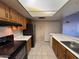 A full kitchen features a kitchen sink, countertops, oven and refrigerator at 1384 N Santa Anna Ct, Chandler, AZ 85224