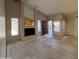 Spacious living room featuring a fireplace, large windows and an open floor plan ready for renovations at 1384 N Santa Anna Ct, Chandler, AZ 85224