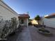 Private courtyard features mature landscaping, an outdoor seating area, and a decorative fountain at 1384 N Santa Anna Ct, Chandler, AZ 85224