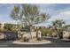 Gated entry to the Copperwynd Villas with desert landscaping and views of the community homes at 14850 E Grandview Dr # 233, Fountain Hills, AZ 85268