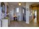 Bright foyer with hardwood floors, arched doorway and decorative accents at 14850 E Grandview Dr # 233, Fountain Hills, AZ 85268